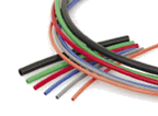 A bunch of different colored wires are laying on the ground