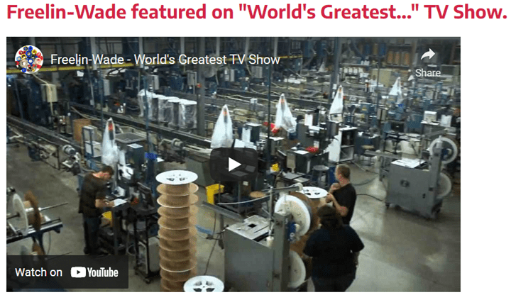 A factory with workers working on machines.
