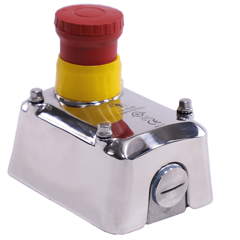 A red and yellow button on top of a metal box.