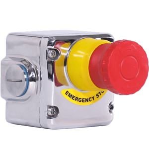 A red and yellow emergency stop button on a green background.