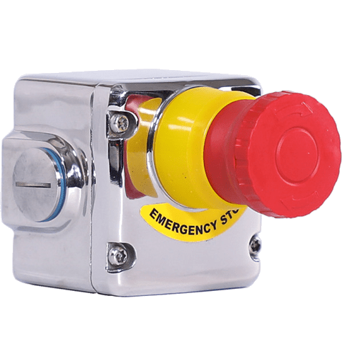 A red and yellow emergency stop button on a green background.