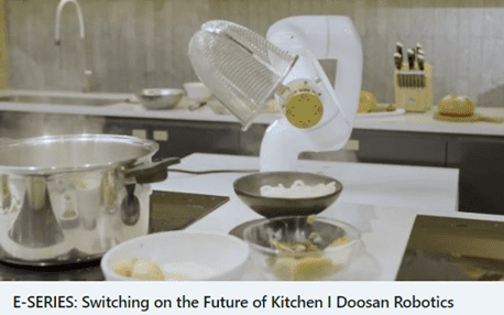 A robot is cooking food in the kitchen.