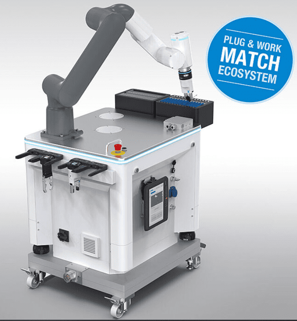 A robot arm is attached to the side of a machine.