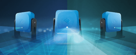 A blue theater seat illuminated by a spotlight.