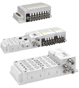 Three white industrial pneumatic valve manifolds with multiple ports and connectors.