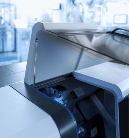 Close-up of a modern printer in an office setting.