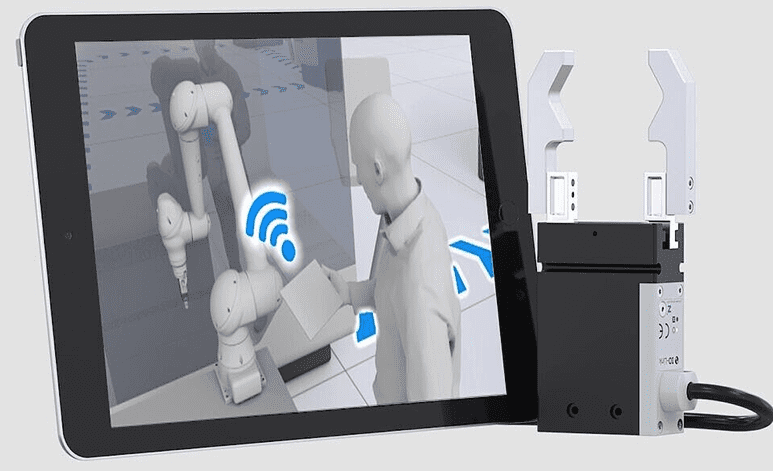 Tablet showing robot arm control with gripper
