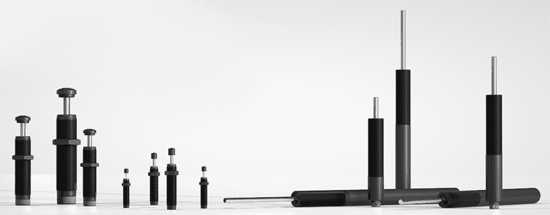 Assorted black gas springs on white background