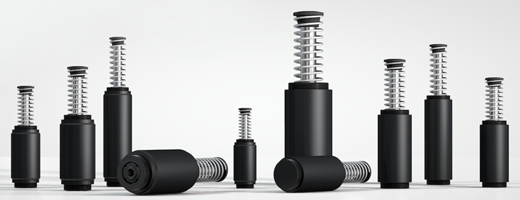 Assorted black spring-loaded shock absorbers on white