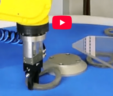 Robotic arm assembling circular metal parts