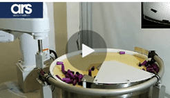 Industrial robot assembling parts on rotating table