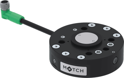 Round black sensor module with green cable connector