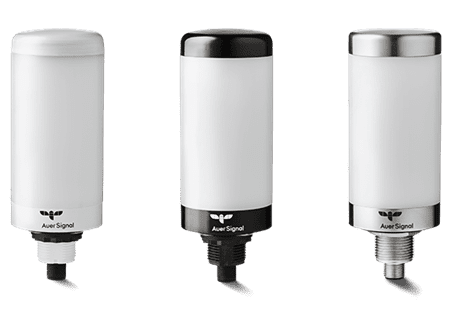 Three white cylindrical industrial signal lights